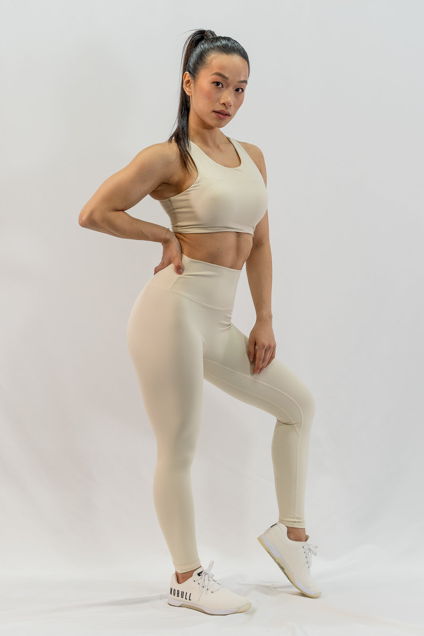 Dynamic Asymmetric Cut Sports Bra in Creamy White - Inner Glö Apparel