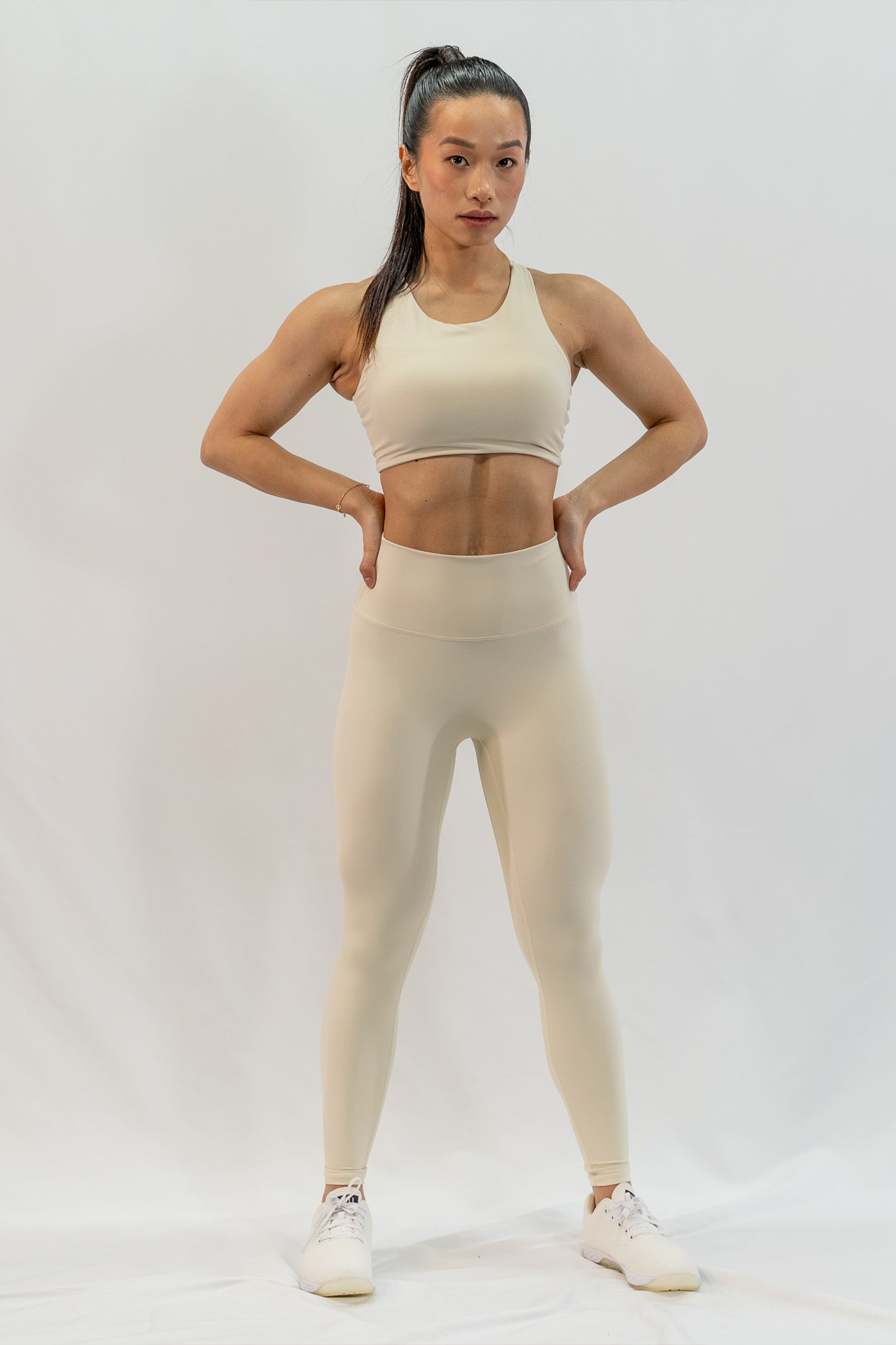 Dynamic Asymmetric Cut Sports Bra in Creamy White - Inner Glö Apparel