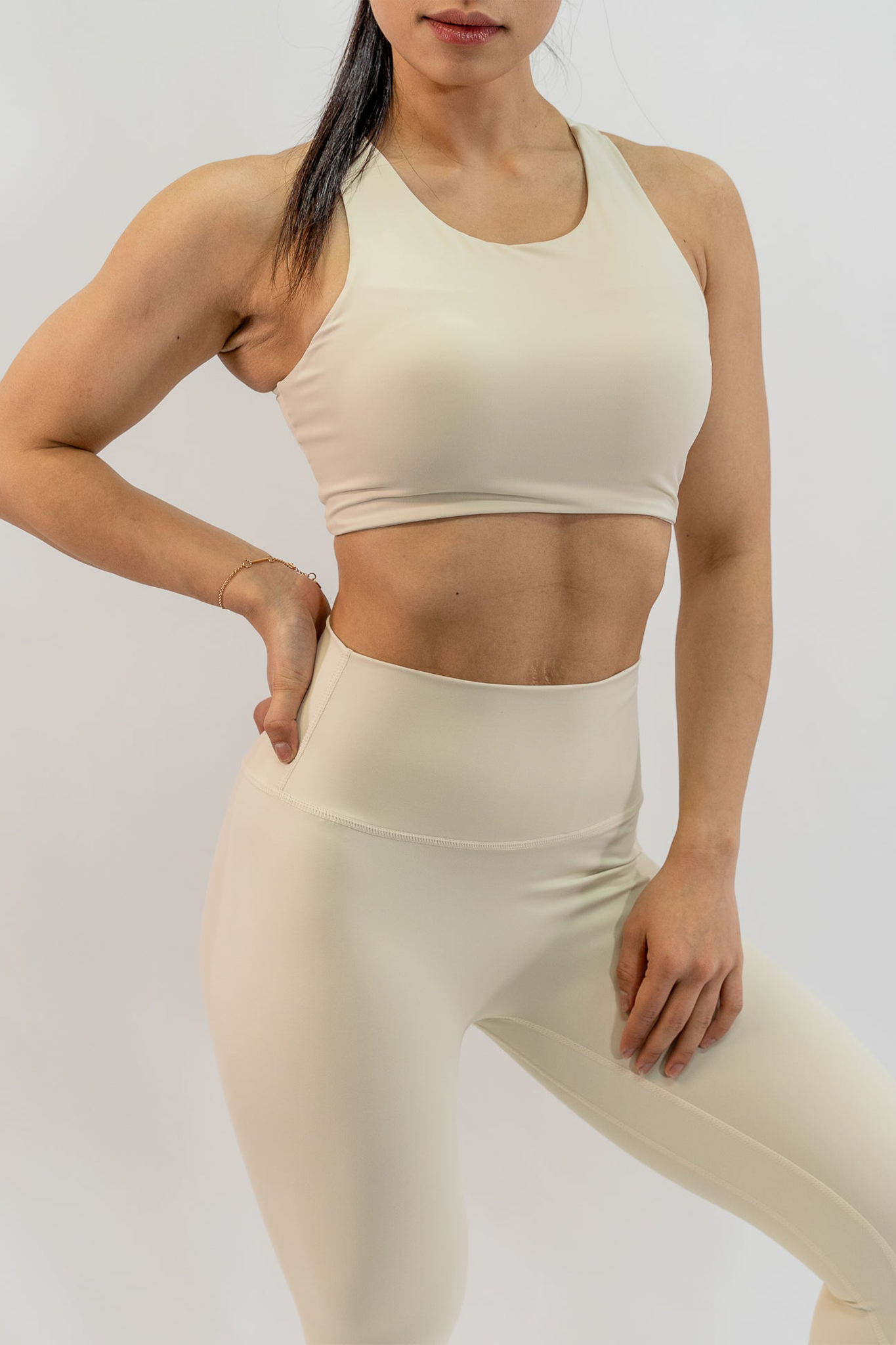 Dynamic Asymmetric Cut Sports Bra in Creamy White - Inner Glö Apparel