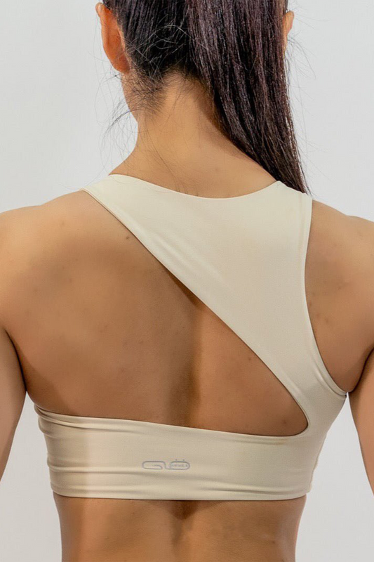 Dynamic Asymmetric Cut Sports Bra in Creamy White - Inner Glö Apparel