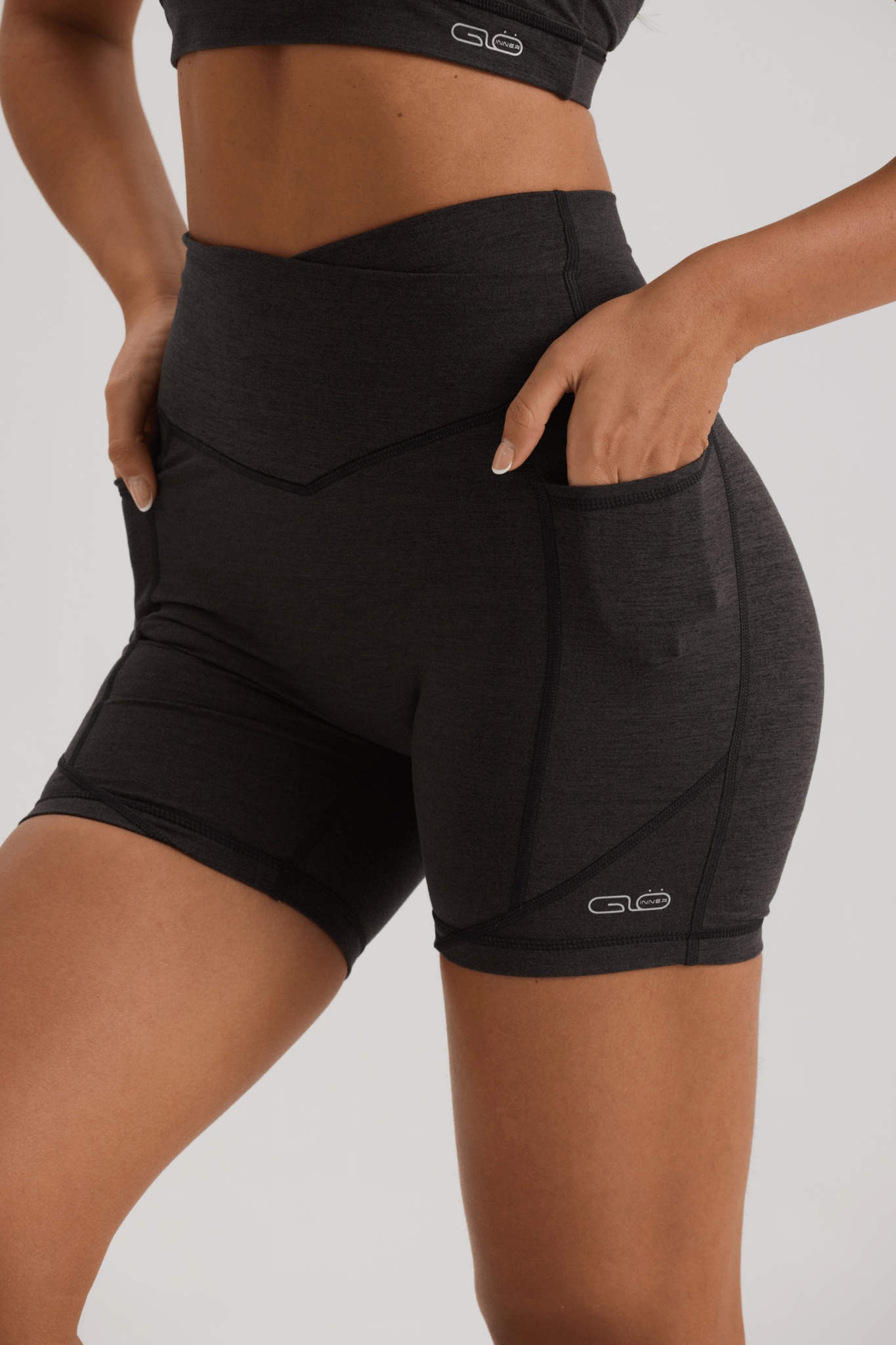 Bliss Cross Invisible Scrunch Shorts with Pockets in Black - Inner Glö Apparel
