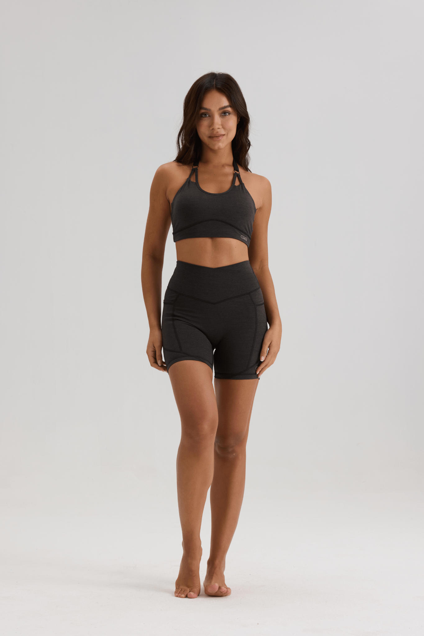 Bliss Cross Invisible Scrunch Shorts with Pockets in Black - Inner Glö Apparel