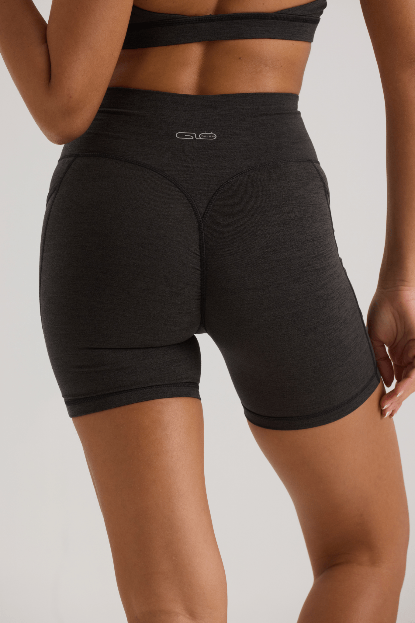 Bliss Cross Invisible Scrunch Shorts with Pockets in Black - Inner Glö Apparel