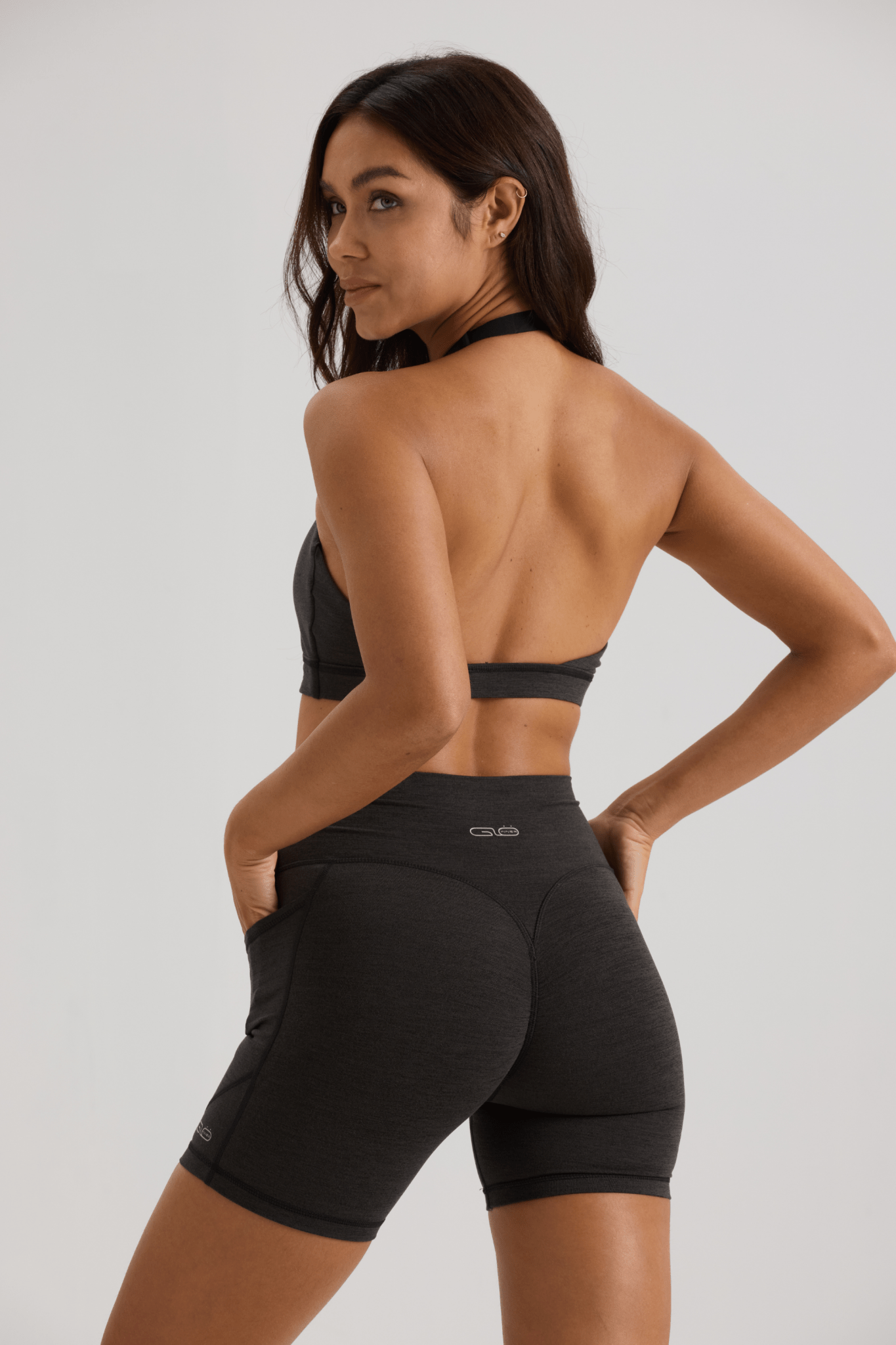 Bliss Cross Invisible Scrunch Shorts with Pockets in Black - Inner Glö Apparel